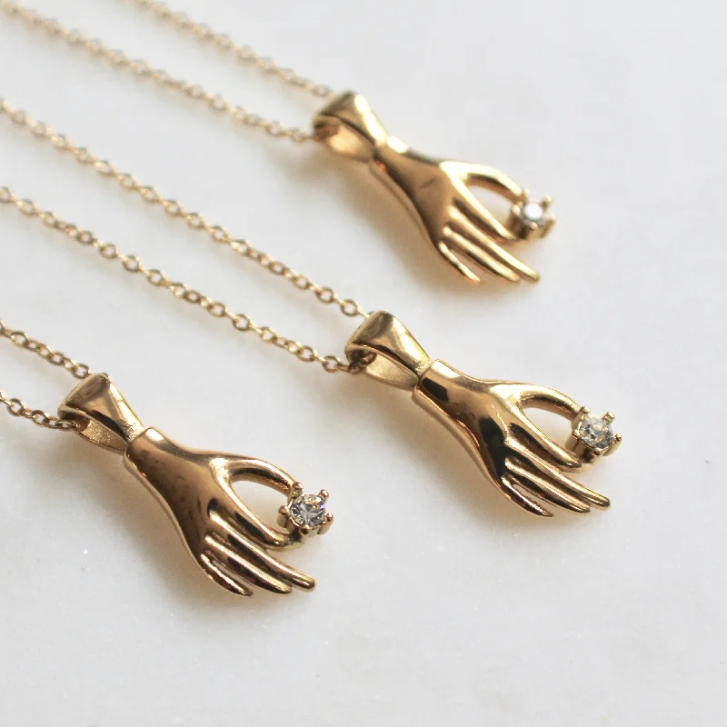 Hand gold necklace